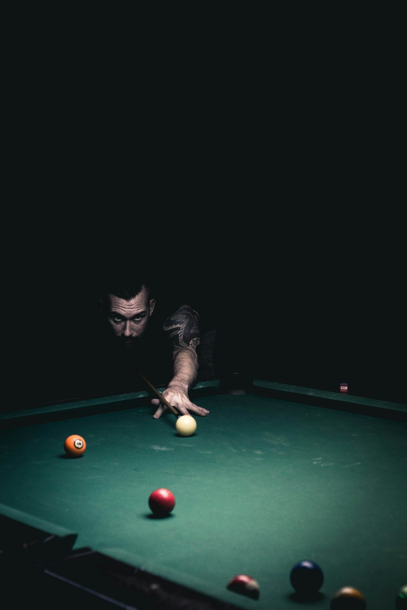 Focused snooker player preparing a shot